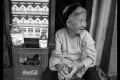 Woman selling water and Malboros on the street in Hanoi