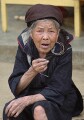 Old black h'mong woman beggar, Sapa