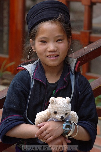 Black h'mong girl with teddy bear, Sapa