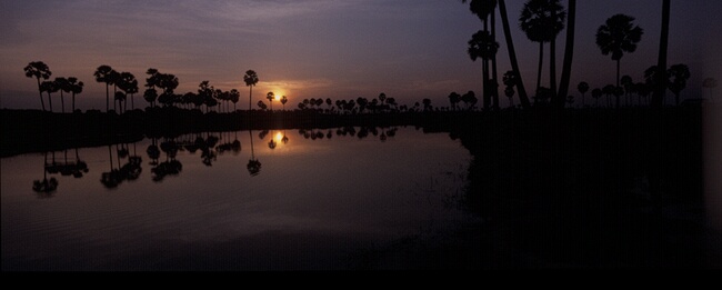 Sunset reflected in pool, Phnom Penh