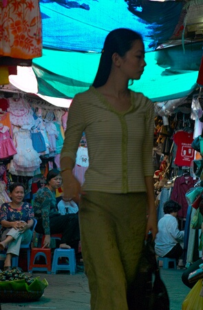 Elegant woman in the side alley at  Central Market, Phnom Penh, Cambodia