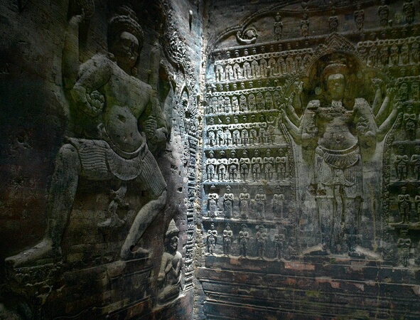 Bas reliefs inside Prasat Kravan (the 'Cardamon Sanctuary'), Angkor Complex, Cambodia