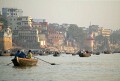 The Ganges river, Varanasi - tourists float serenely down the river just after dawn