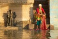 There are thousands of large and small shrines and lingas in Varanasi - at, above and below the present water level.   Everyday life goes on as they watch