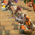 Beggars hoping for alms line the steps up from Dashashwamedh Ghat