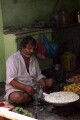 Shopkeeper boiling curds, old Varanasi