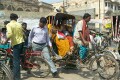 The streets are crowded with pedestrians, pedicabs and motorised vehicles, Varanasi