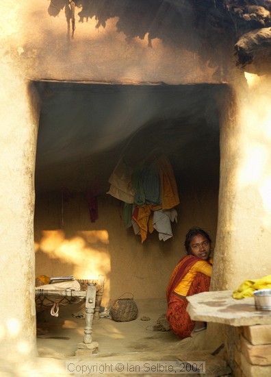 In the countryside near Varanasi: smoke from the open fire trickles out of a mud hut