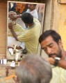 There are many barbers on the Ghats offering shaving and haircuts